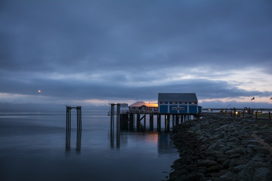 Ocean Market with the lights on the coast At Dawn