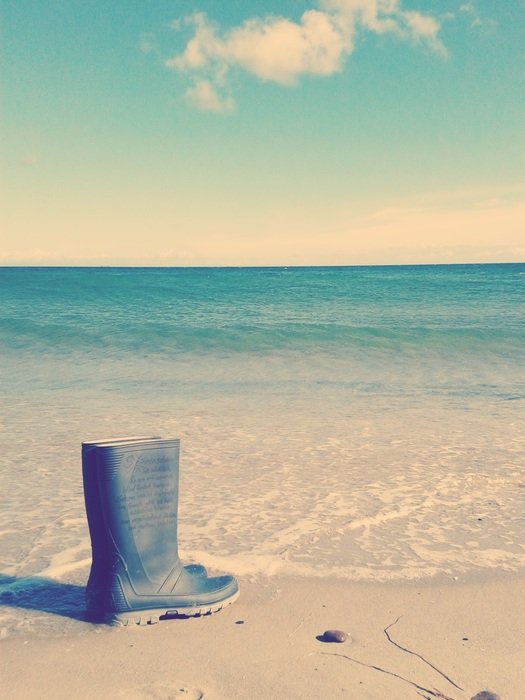 rubber boots by the ocean