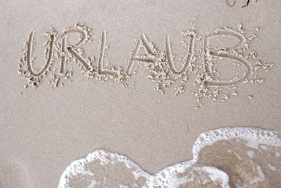 Picture of text on a sand