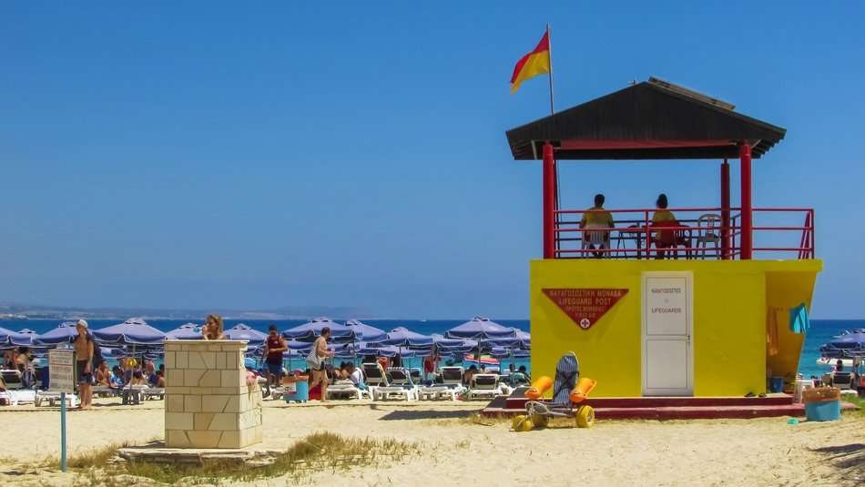 yellow lifeguard tower on the beach in cyprus