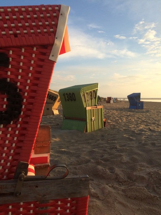 deckchairs on the north sea in the evening light