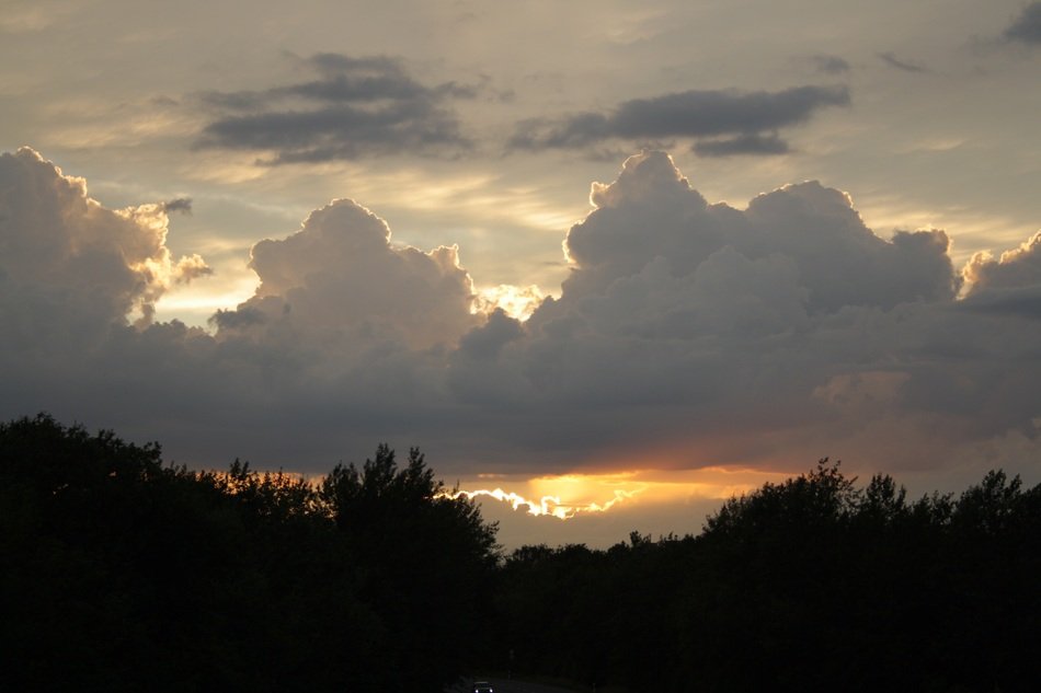 curly clouds in the sunset