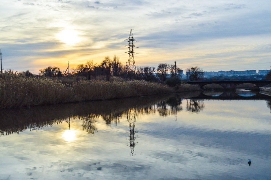 photo of the river at sunset in Mariupol