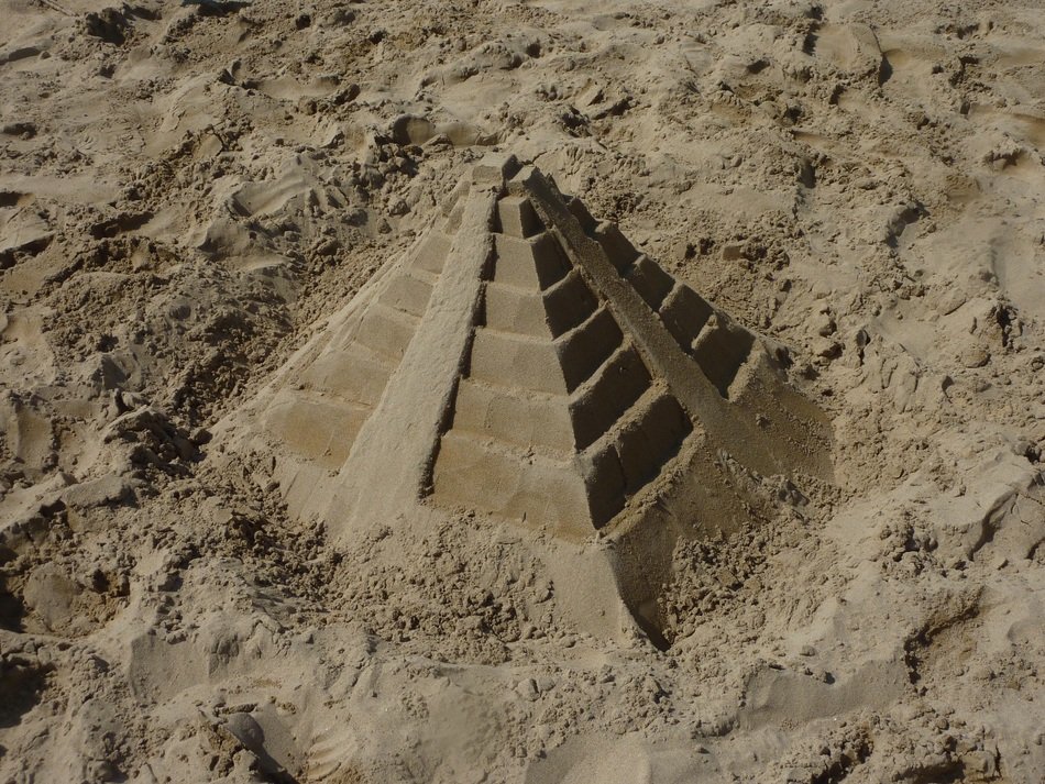 sand pyramid on the beach in Italy