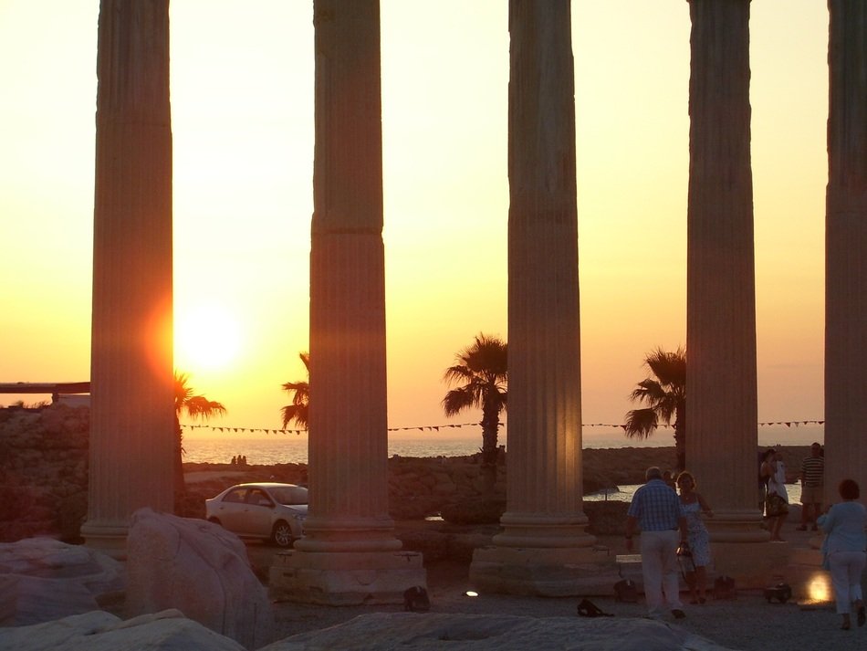 ancient colonade in the rays of sunset