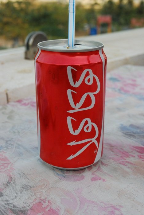 can of cola with a straw in jordan