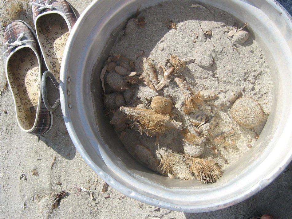 sand bucket next to the shoes