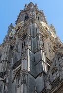 View of the cathedral with bell tower at blue sky background in Antwerp, belgium