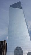 mirroring glass facade of skyscraper in new york