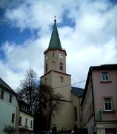 building with spire in the middle of the city