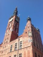 tall clock tower against blue sky