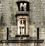 statue in an ancient stone castle