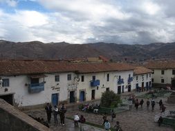 people near the building in peru