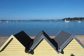 roofs of houses in the background of the sea