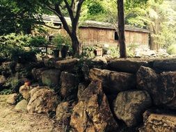 stone wall at the wooden house