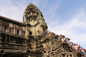 people on the stairs to the tower angkor wat temple