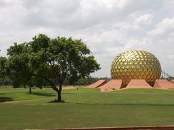 golden circular building in Pondicherry, India