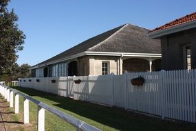 home behind the white fence