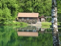 fishing house on the shore of a beautiful lake