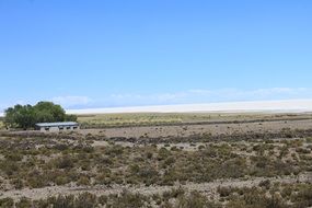 small house on the background of the steppe