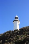 white lighthouse on the mountain