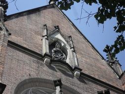 statue on the facade of the church