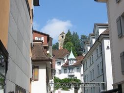 white cozy houses and clock tower, switzerland, lucerne