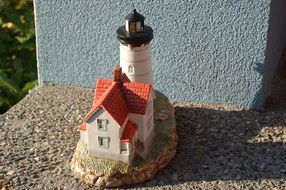 Lighthouse model, figurine on stone