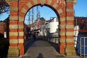 old brick gate on a embankment