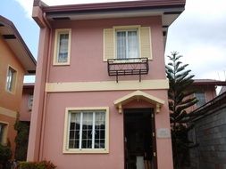 house with pink facade in batangas