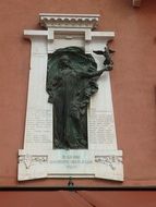 woman with winged symbol statue, italy, verona