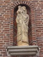 statue of a man with a jug