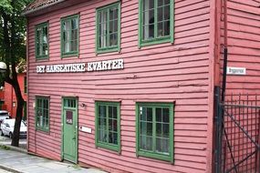 Wooden house with pink walls in Norway