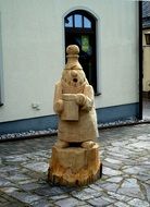 funny human wooden figure in the city