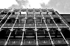 wrough iron passages on facade of old building