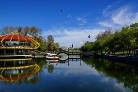 Reflection of the city park in the pond