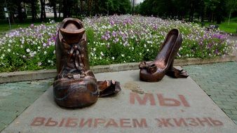 bronze shoes monument on a boulevard