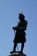 male statue with seagull on the head