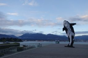 statue of orcas in Vancouver