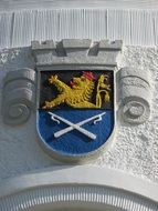 coat of arms on a white wall