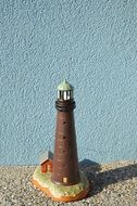 small brown lighthouse statue