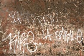 white writing on grunge wall, france, lyon