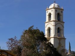 old white tower on a background of blue sky