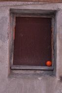 orange ball on the building window