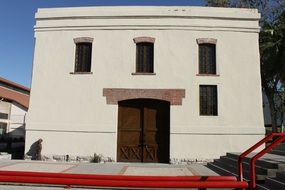modest house with big brown doors