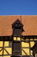 old yellow timber framed house