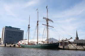 big ship at the pier in the city