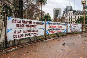 posters on the fence during a protest in Argentina