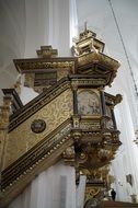 gilded baroque pulpit in a church