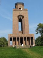 historic tower on a green hill